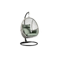 **Suspension en fauteuil œuf avec coussins en tissu vert**